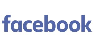 農家がパソコンでFacebook広告を設定している